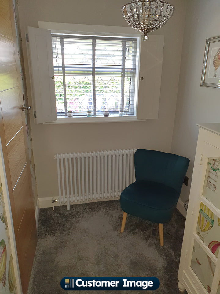Customer photo of a Alpha White column radiator installed in a home interior