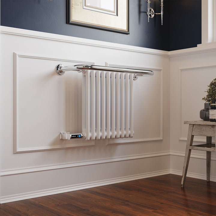 Aydon traditional electric towel rail, 491mm x 741mm, 300W thermostatic WiFi white radiator, mounted on a white wall with wooden floor