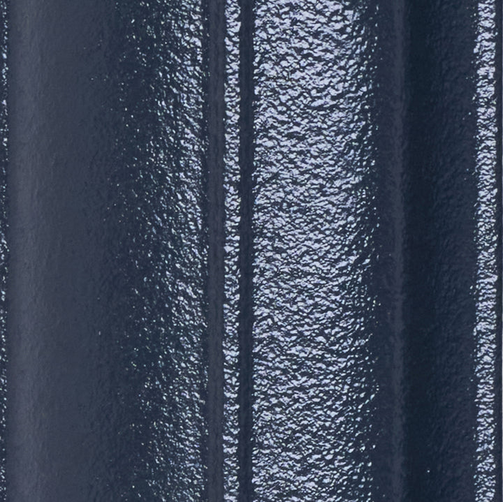 Close-up of the Anthracite cast iron radiator finish on a curved column surface.