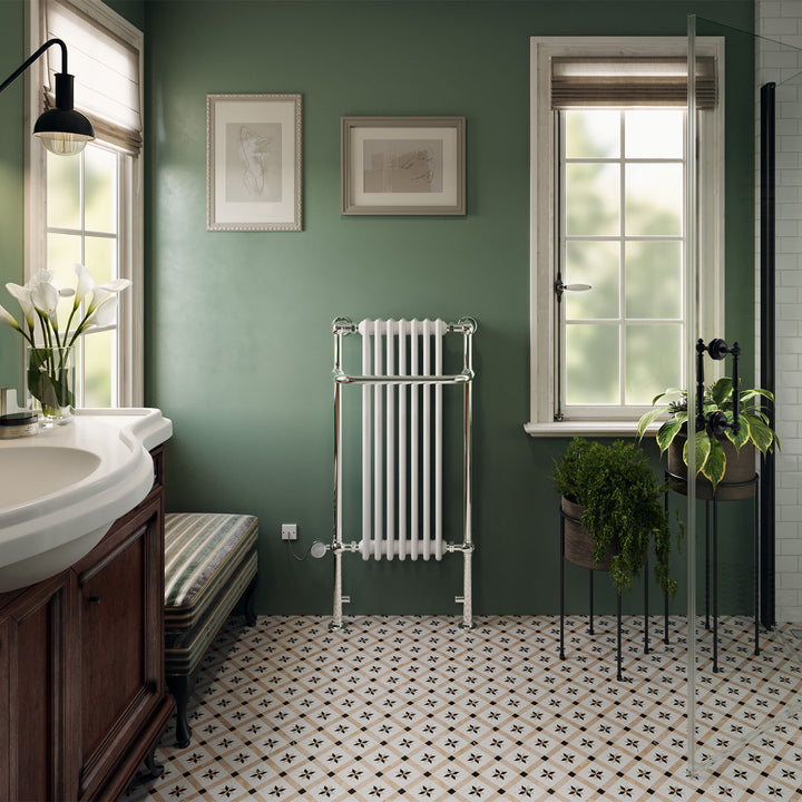 Balmoral traditional electric towel rail, 1130mm x 553mm, 300W thermostatic chrome radiator, fitted in a bathroom interior on a green wall