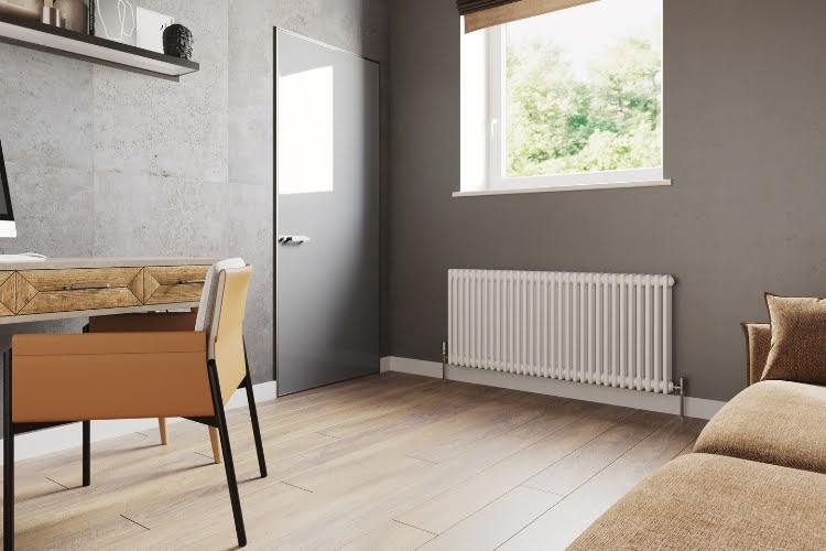 Modern home office with wall-mounted radiator under window.