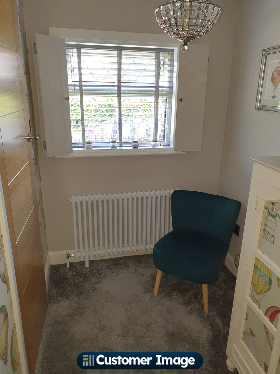 Customer photo of a Alpha White column radiator installed in a home interior