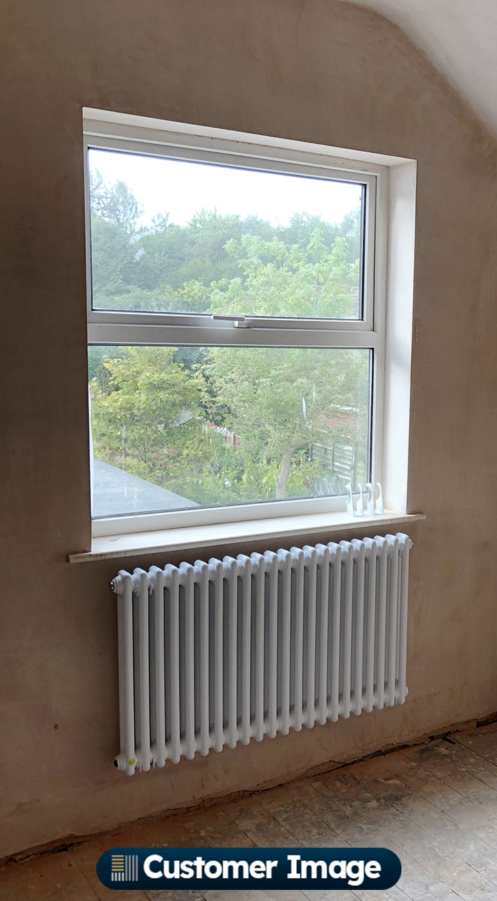 Customer photo of a Alpha White column radiator installed in a home interior