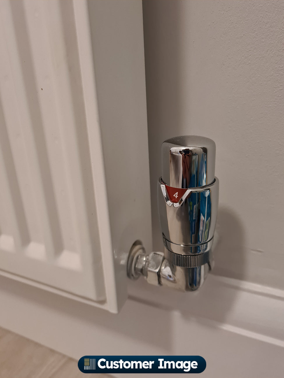 UK Radiators - Talus Flair Thermostatic Radiator Valve Chrome Corner installed in room