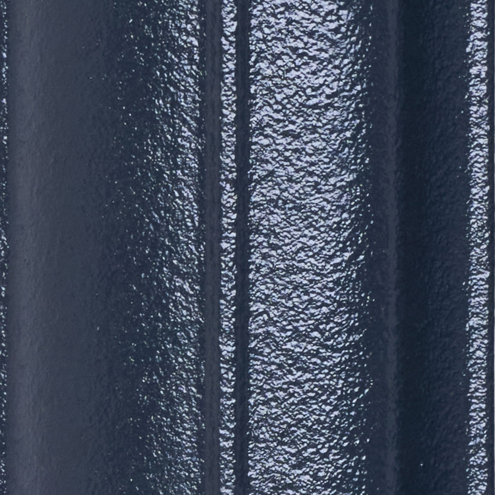 Close-up of the Anthracite cast iron radiator finish on a curved column surface.
