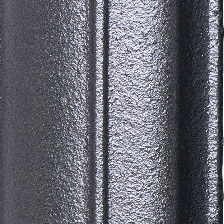 Close-up of the Astral Grey Mid cast iron radiator finish on a curved column surface.