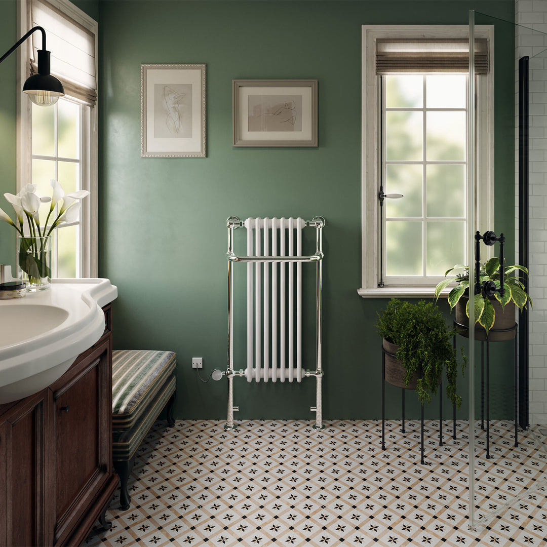 Balmoral traditional electric towel rail, 1130mm x 553mm, 300W thermostatic chrome radiator, fitted in a bathroom interior on a green wall