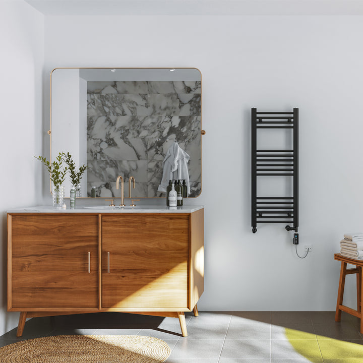 Zennor black dual fuel heated towel rail, 1000mm x 400mm thermostatic WiFi straight radiator, fitted in a bathroom interior next to a mirror