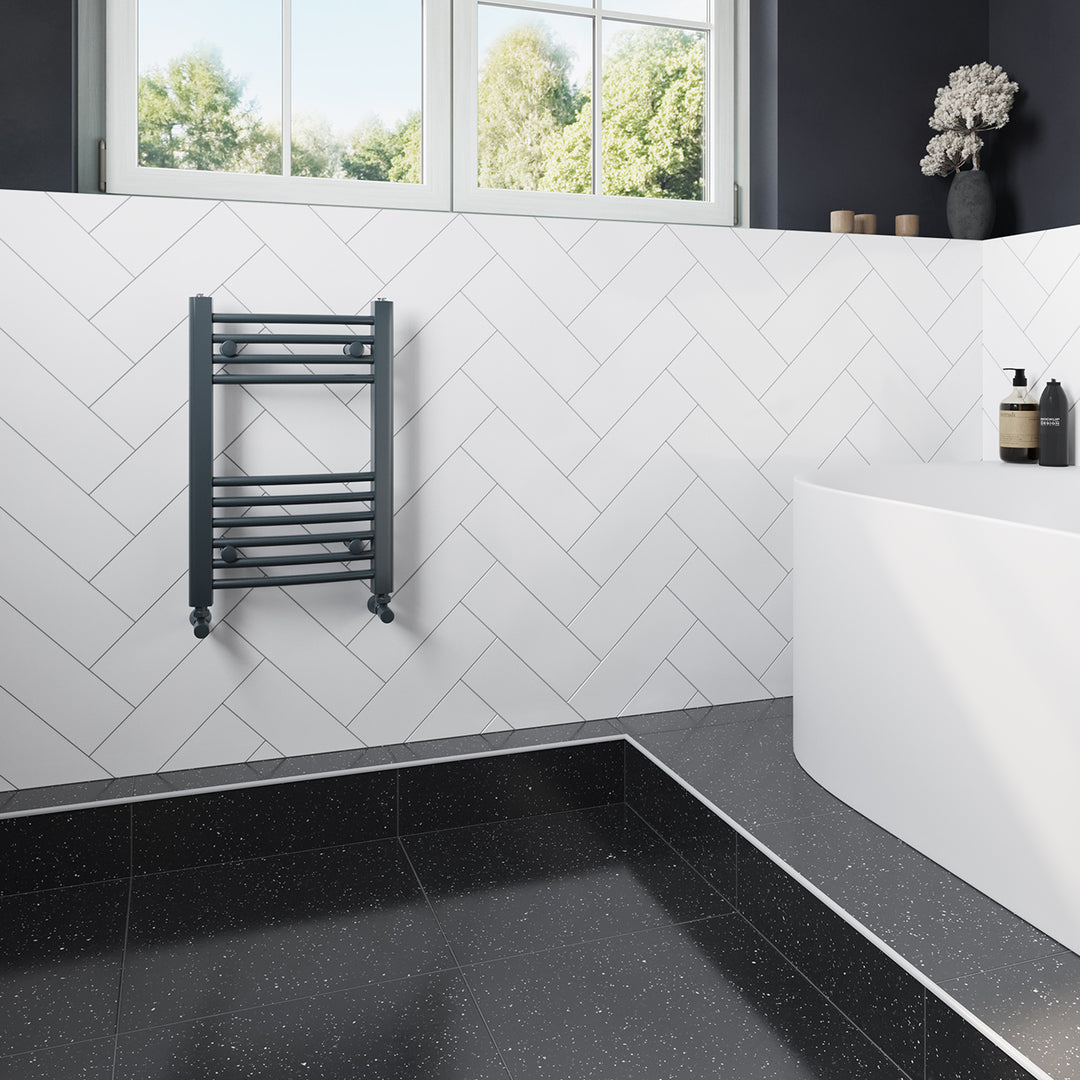 Zennor anthracite heated towel rail, 600mm x 400mm curved compact bathroom radiator, fitted in a modern bathroom