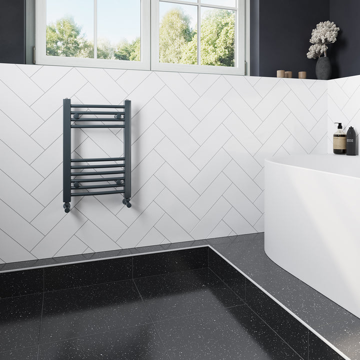 Zennor anthracite heated towel rail, 600mm x 400mm curved compact bathroom radiator, fitted in a modern bathroom