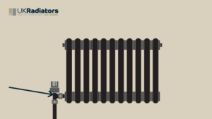 black horizontal radiator with arrow pointing to the valve